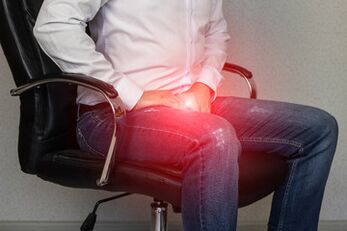 a man with signs of prostatitis